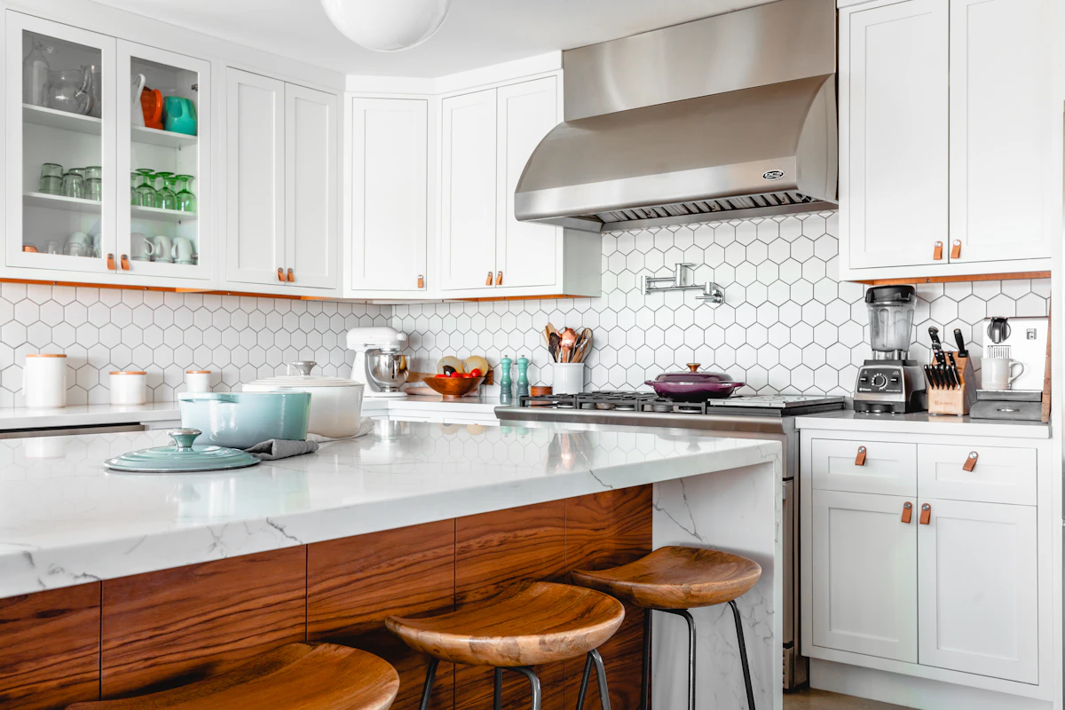 Inspiration photo of a warm kitchen with wood cabinetry and a generous island; not TNC work